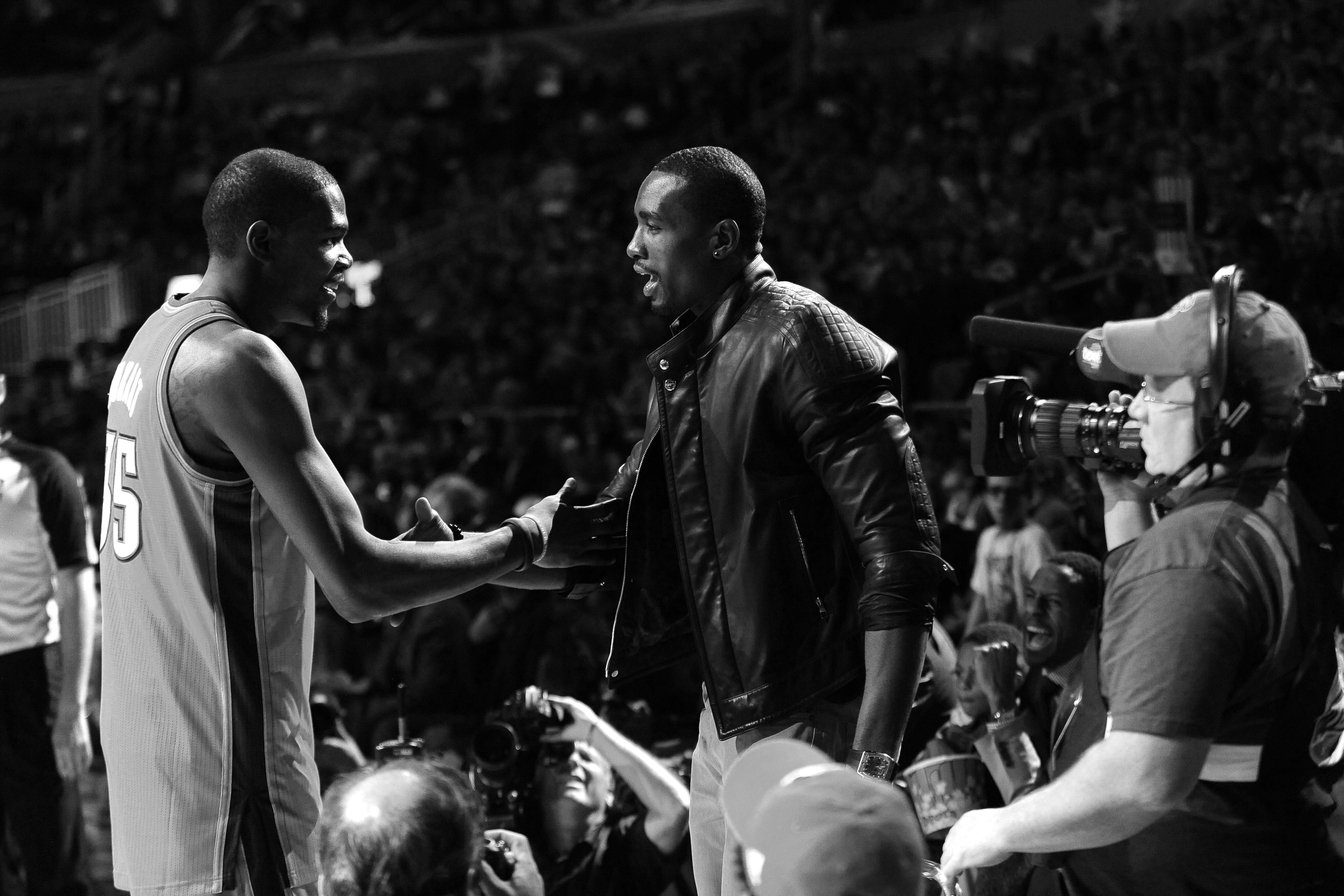 ORLANDO, FL - FEBRUARY 25: Kevin Durant #35 and Serge Ibaka #9 of the Oklahoma City Thunder shake hands during the Foot Locker Three-Point Contest as part of 2012 All-Star Weekend at the Amway Center on February 25, 2012 in Orlando, Florida. NOTE TO USER: User expressly acknowledges and agrees that, by downloading and/or using this photograph, user is consenting to the terms and conditions of the Getty Images License Agreement. Mandatory Copyright Notice: Copyright 2012 NBAE (Photo by Noah Graham/NBAE via Getty Images)